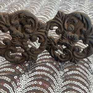 Antique cast iron curtain accents